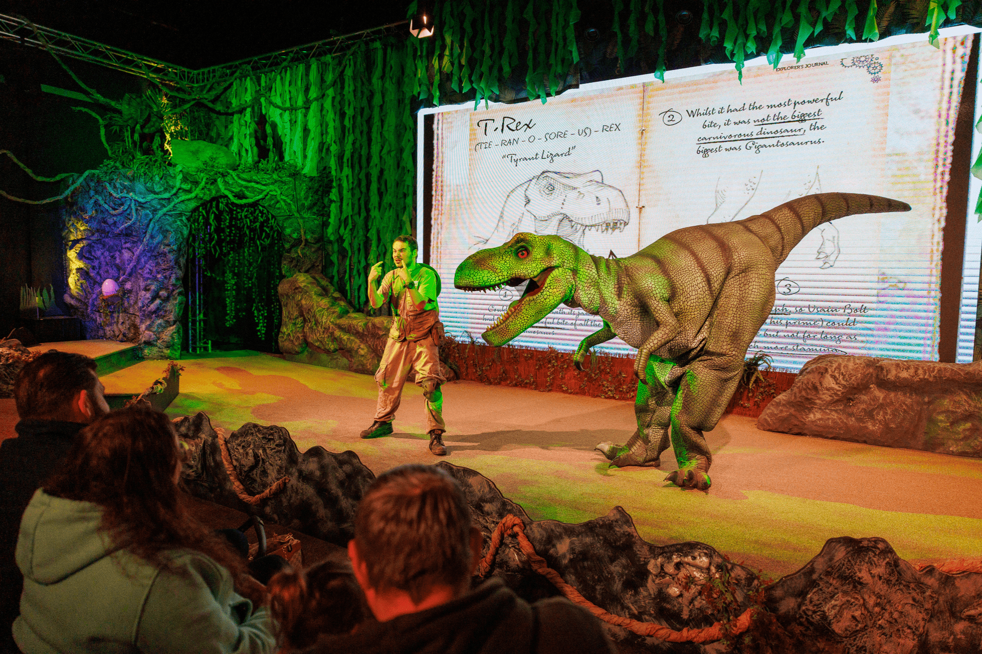 Stage show with caveman and dinosaur at ROARR! Dinosaur Adventure