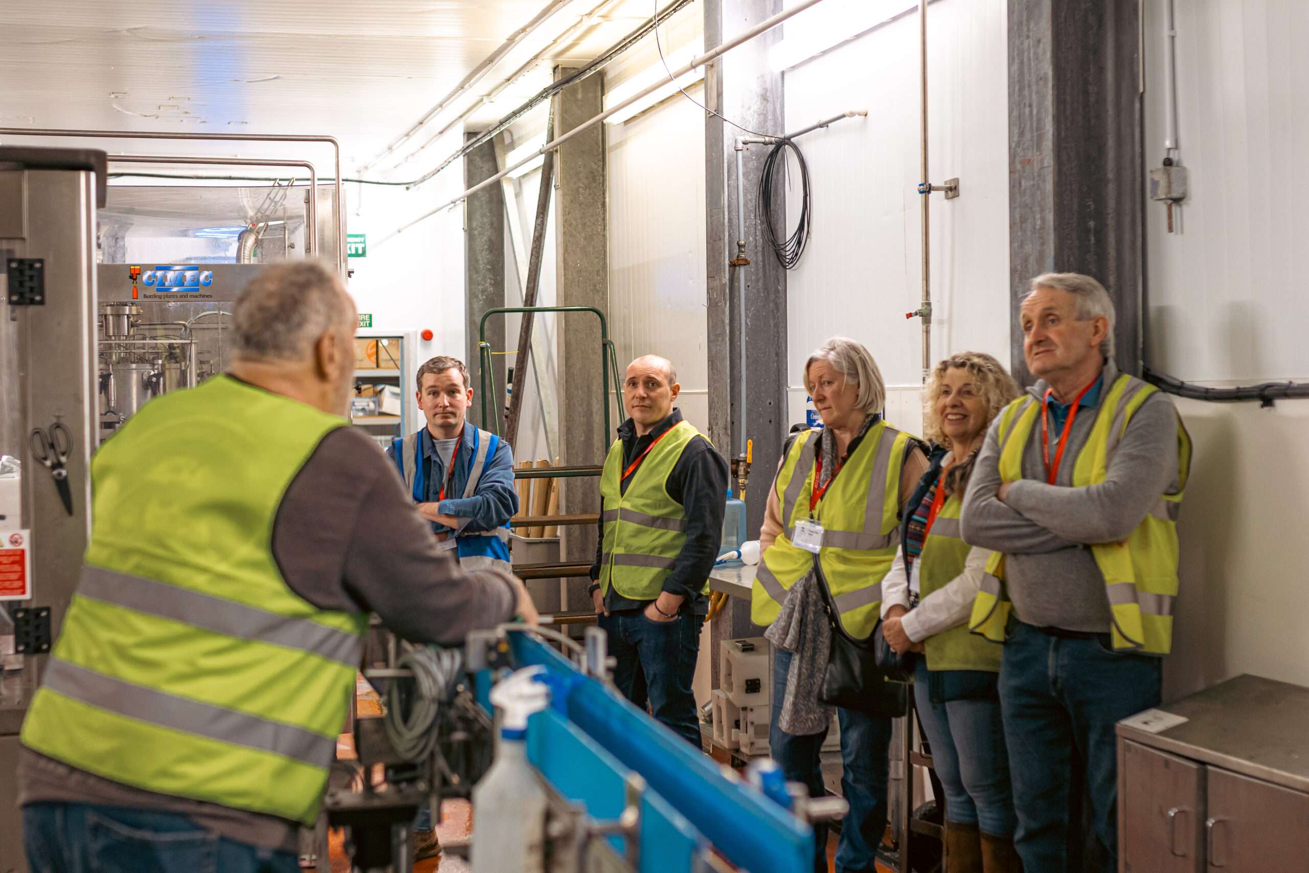 Visitors taking a guided tour of the Woodforde’s Brewery production facility, learning about the brewing process and the history of the brewery.