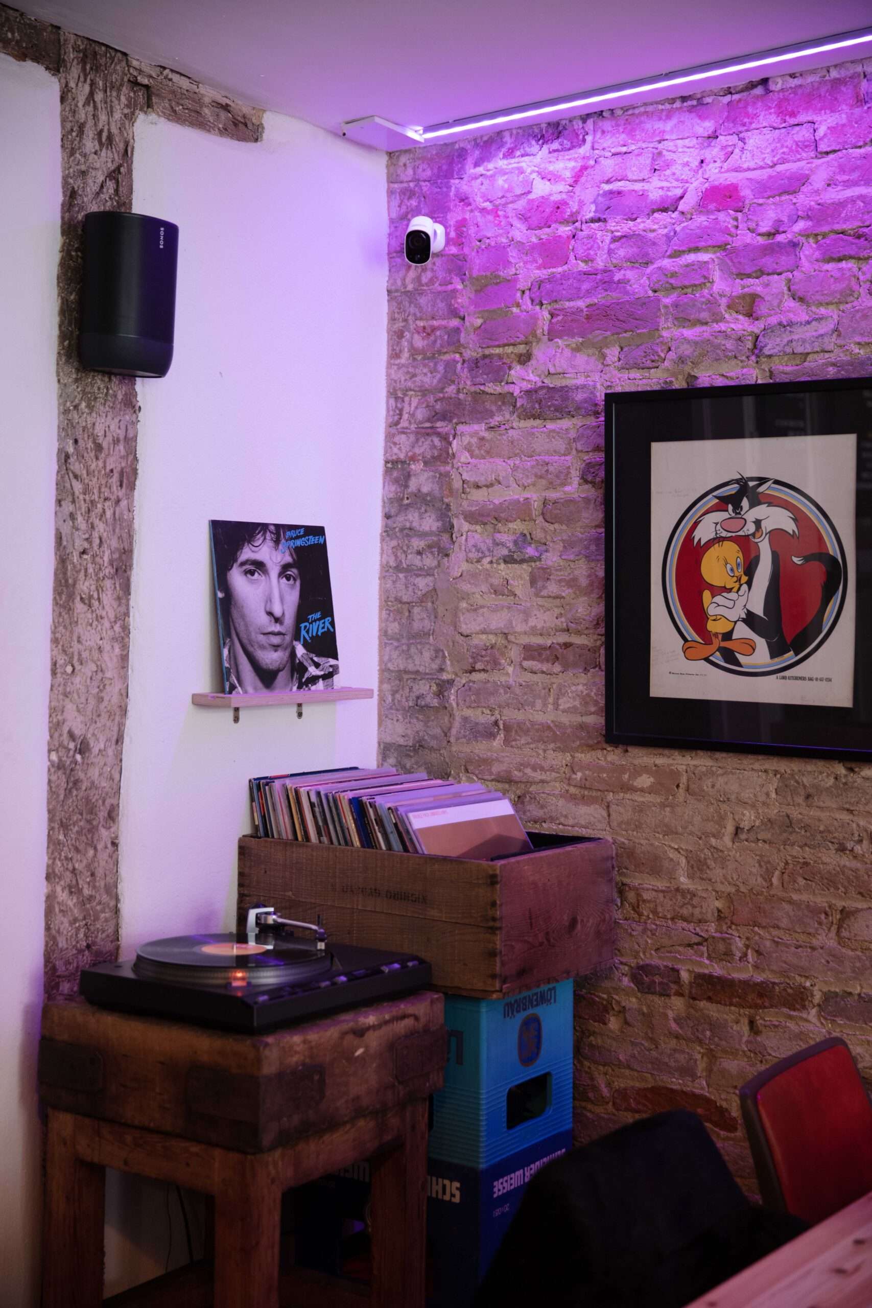 Contemporary interior of Bar 44 featuring exposed brick walls, artwork, comfortable seating and a welcoming atmosphere.