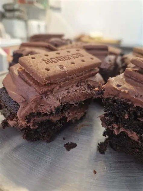 Chocolate traybake topped with a biscuit and chocolate icing, served at Chalfonts Café in Hingham.