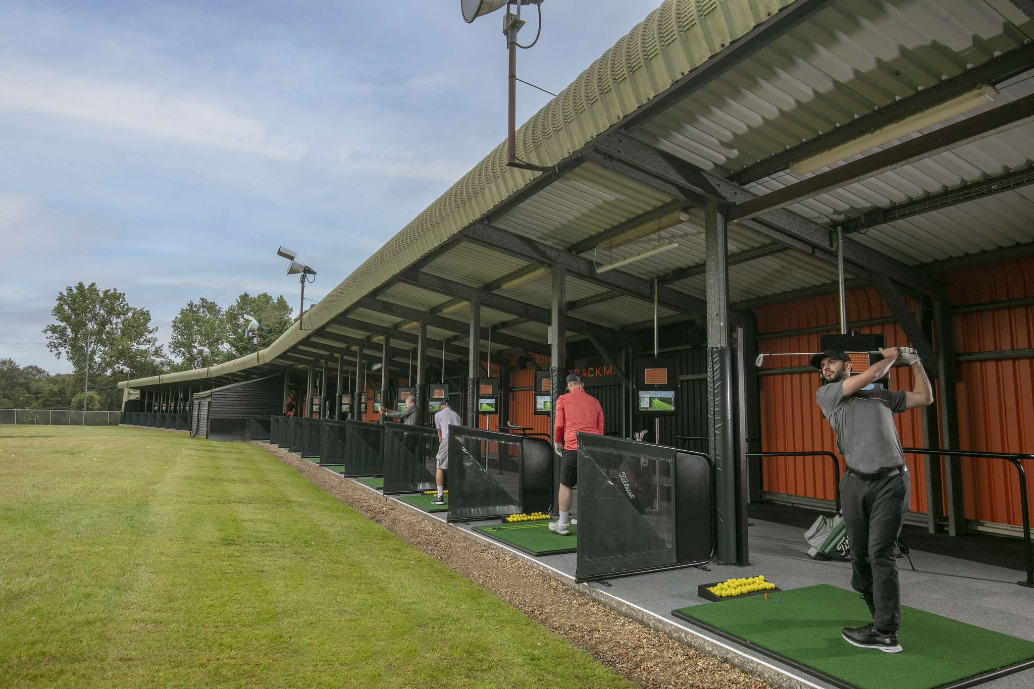 Dunston Hall golf course and driving range featuring TrackMan technology and covered practice bays.