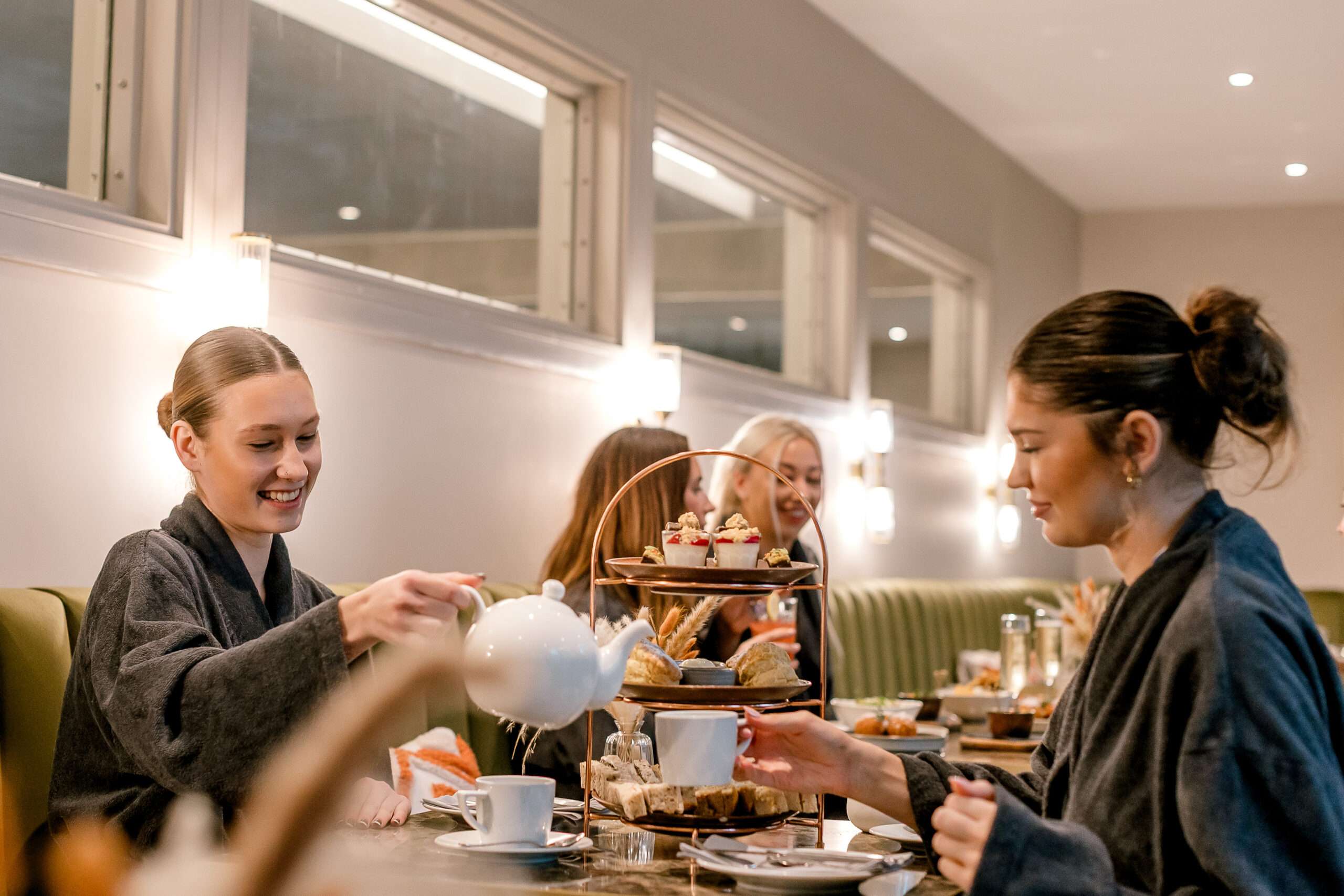 Guests enjoying afternoon tea in the elegant restaurant at Norfolk Mead Hotel.
