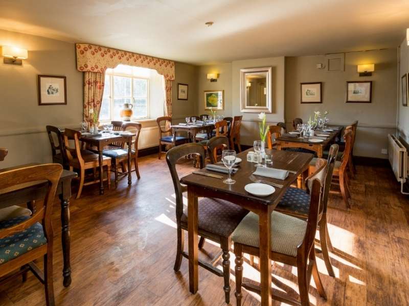 Warm and inviting restaurant at The Recruiting Sergeant, offering comfortable seating and a traditional Norfolk pub dining experience.
