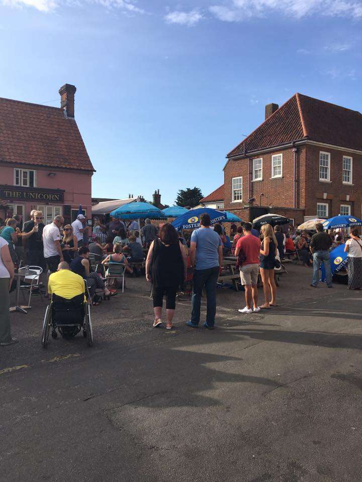 Crowds gathered outside The Unicorn Aylsham for an outdoor entertainment event in the town centre.