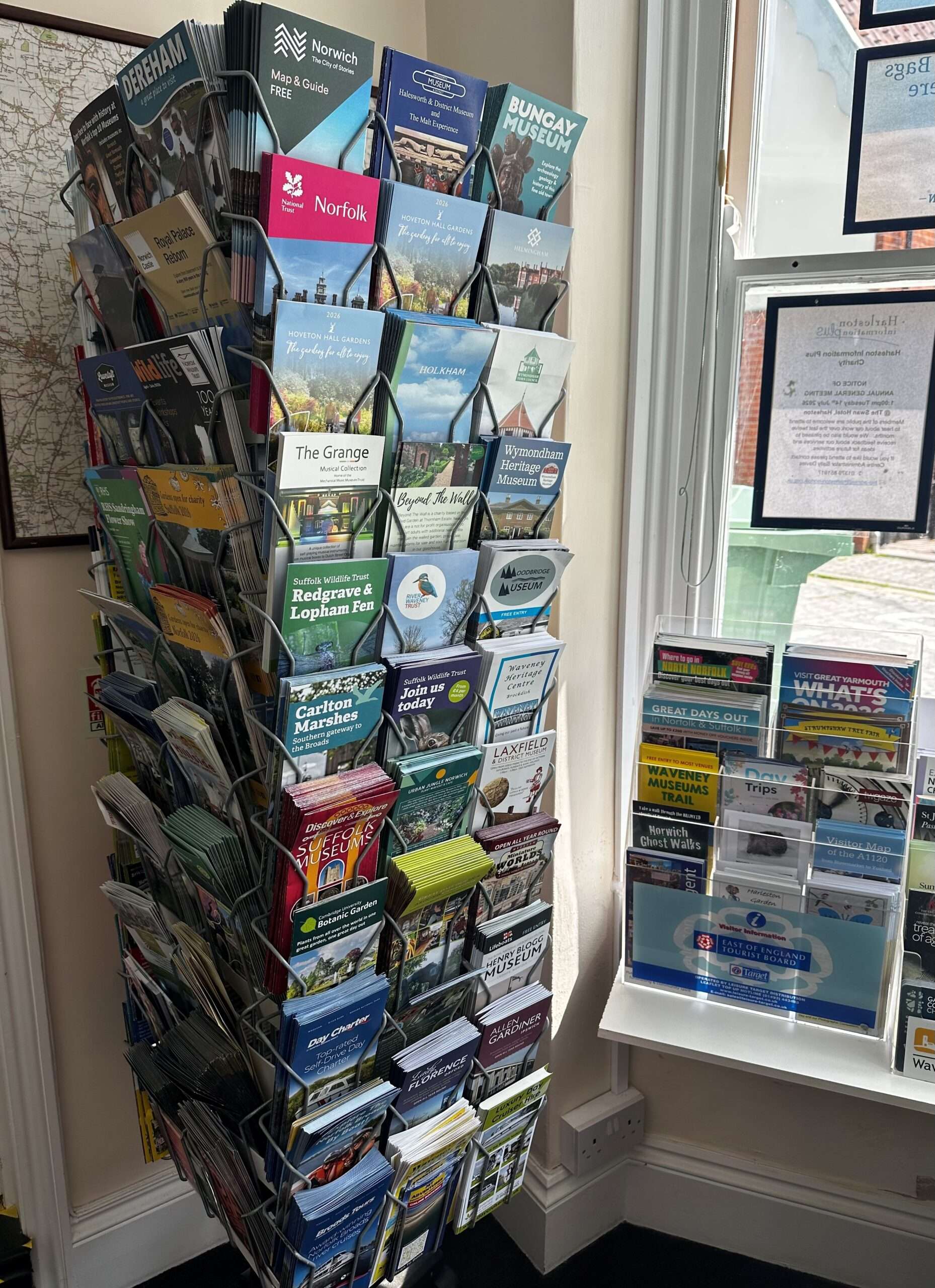 Brochure carousel displaying local attraction leaflets and visitor information.