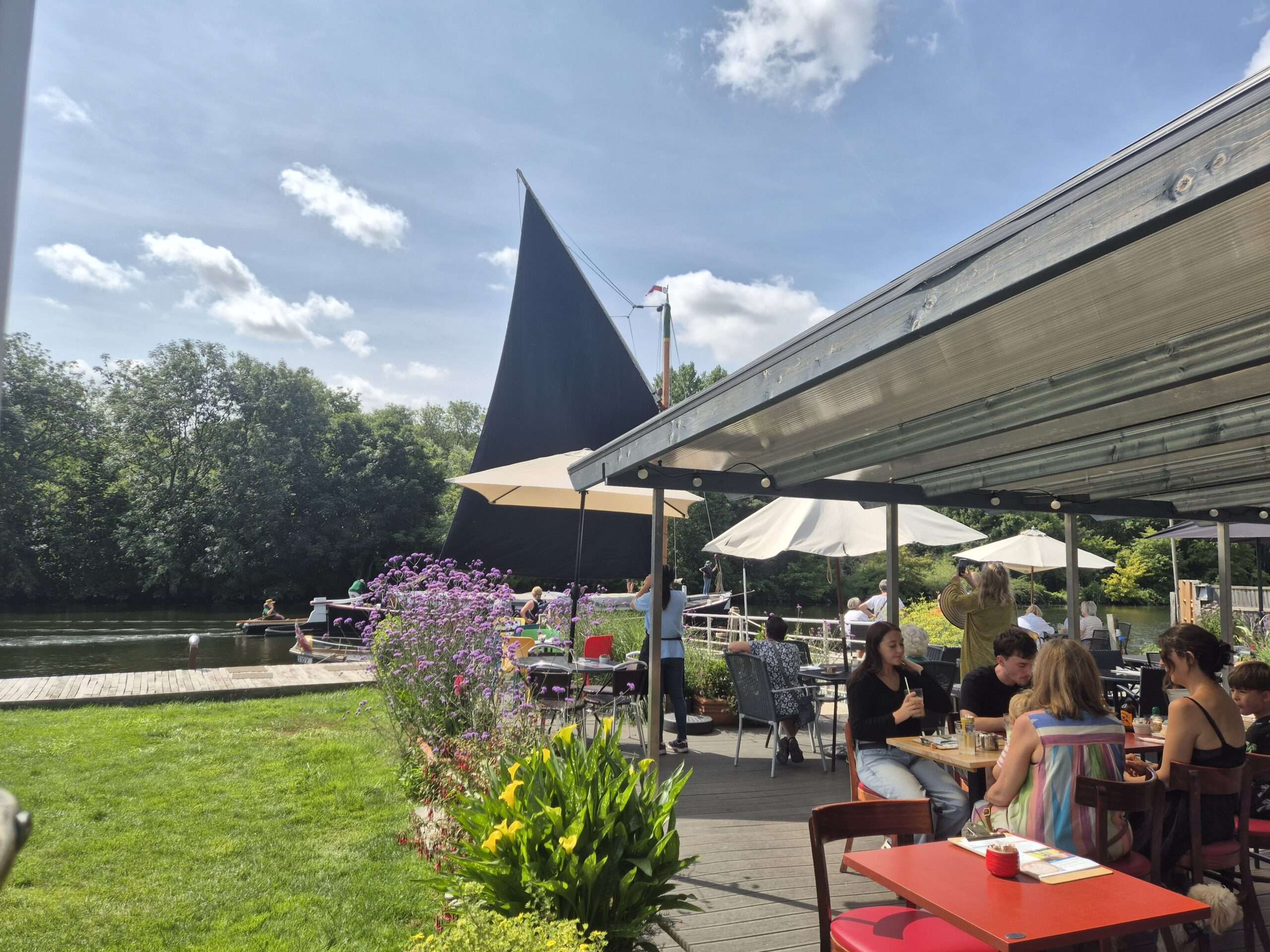 Outdoor terrace seating at Thorpe Ferry Café with church spire views