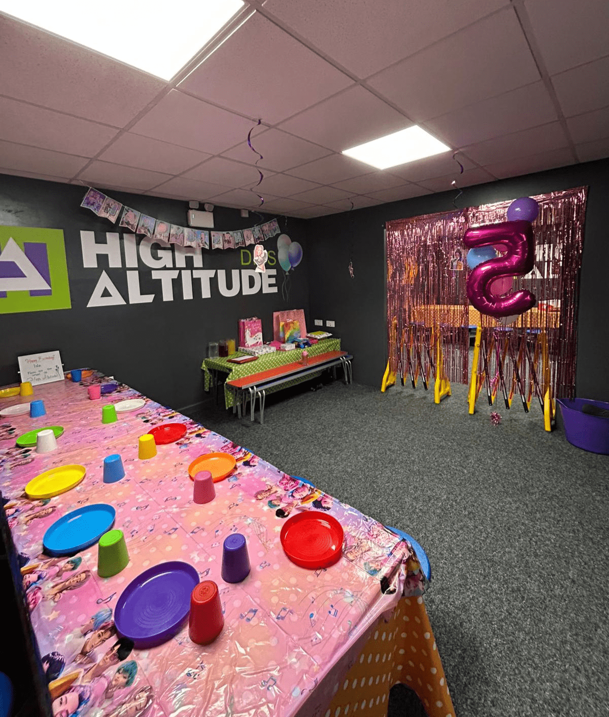 Decorated party room at High Altitude featuring themed seating, party tables and colourful decorations for children's celebrations.