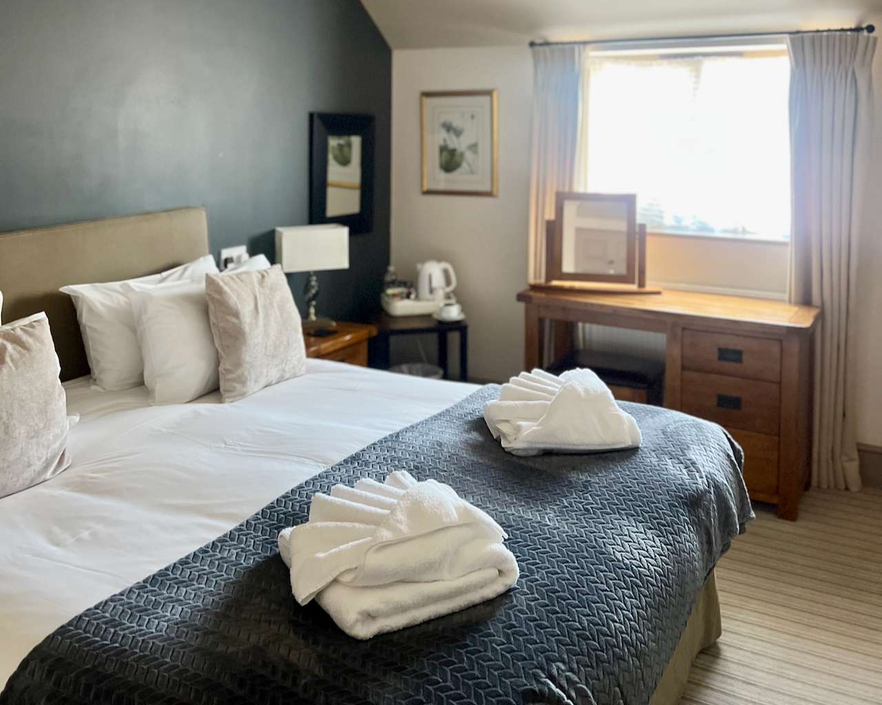 Comfortable guest bedroom at the Parson Woodforde with en-suite facilities.