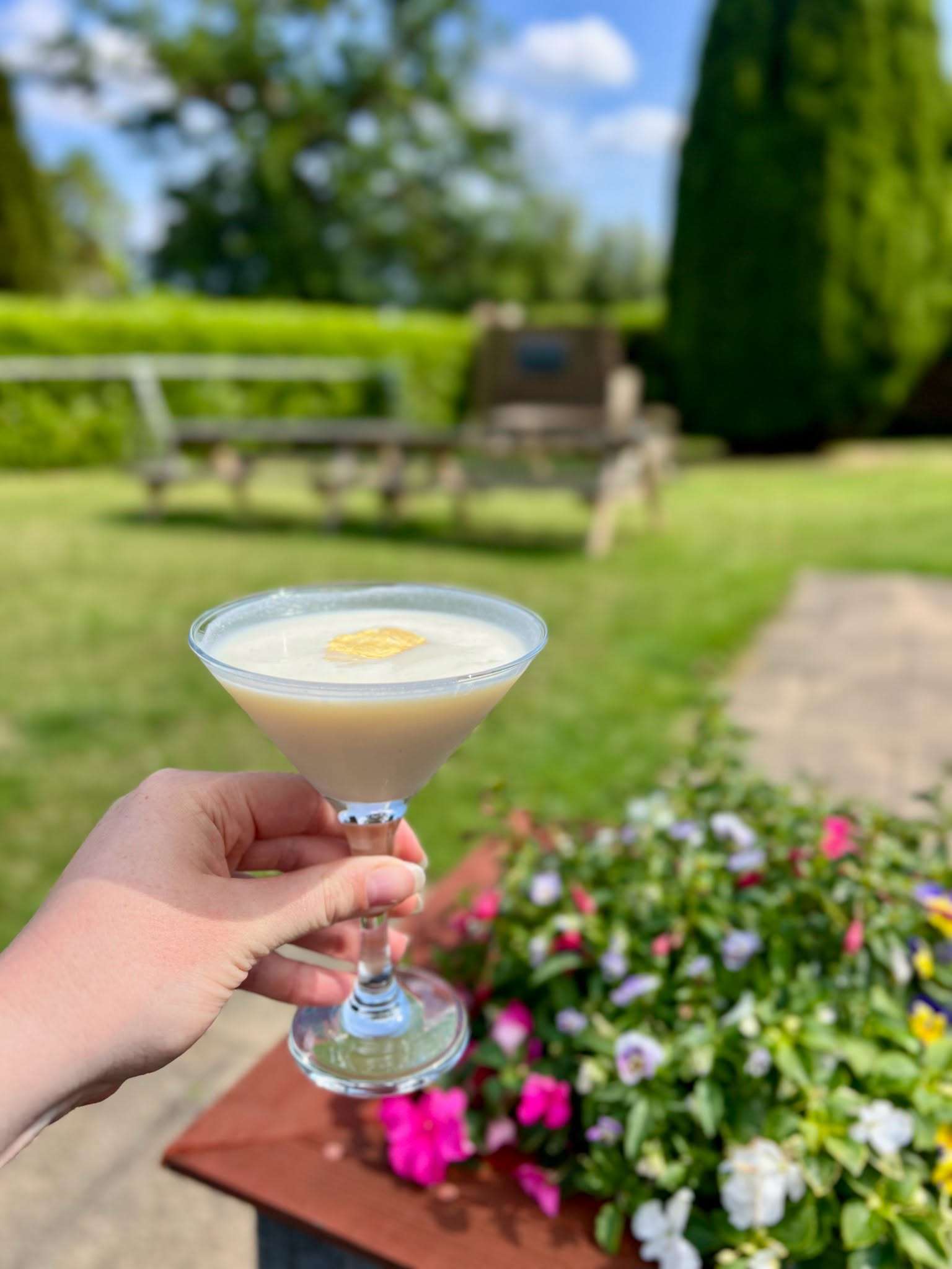 Cocktail glass in a sunny beer garden at the Parson Woodforde.